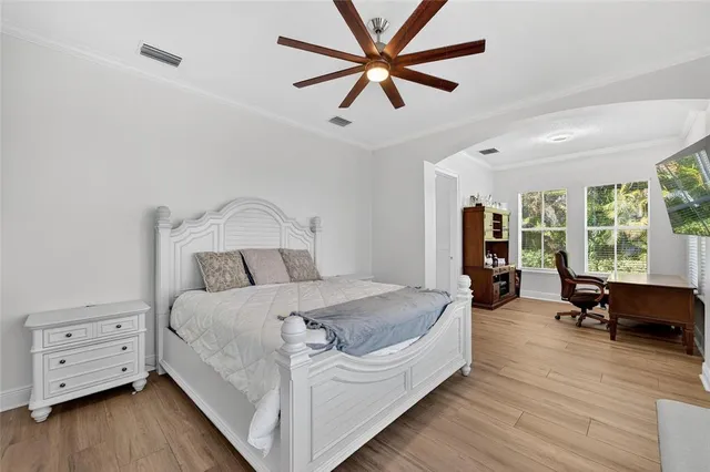 a view of a swimming pool with a table and chairs