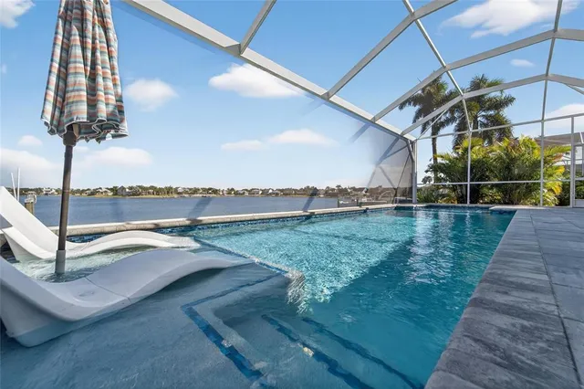 a kitchen with a stove a sink dishwasher and granite counter top