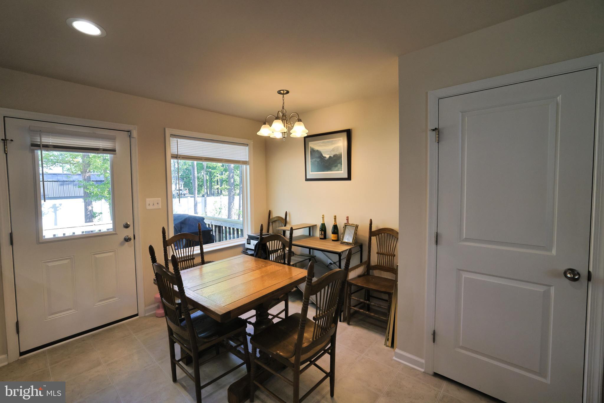 48 Rustic Lane Colonial Beach, VA 22443 - Photo 20 of 47 a view of a dining room with furniture and window