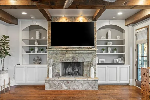 a view of a dining room with furniture wooden floor and chandelier