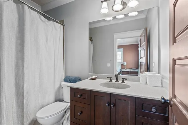 a bedroom with a bed lamp and a window