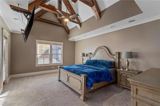 a living room with a fireplace and a flat screen tv