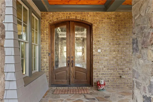 a view of livingroom with hardwood floor and a kitchen view