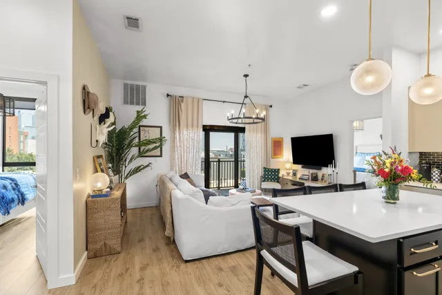 a work room with furniture and a flat screen tv