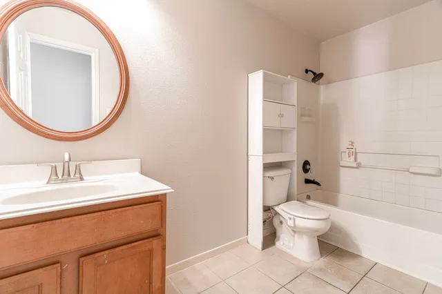 a view of a big room with closet and chandelier fan
