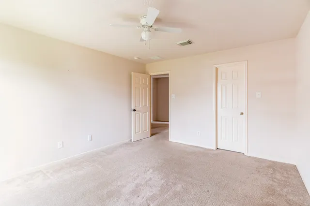 a view of a big room with carpet