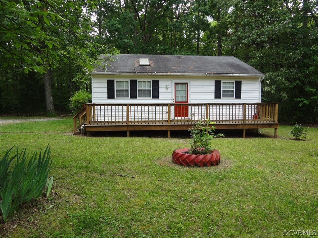 3198 Lowry Road Columbia, VA 23038 - Photo 1 of 19 a front view of a house with a garden