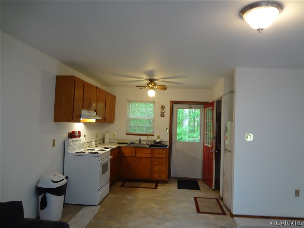 3198 Lowry Road Columbia, VA 23038 - Photo 19 of 19 a kitchen with sink cabinets and window