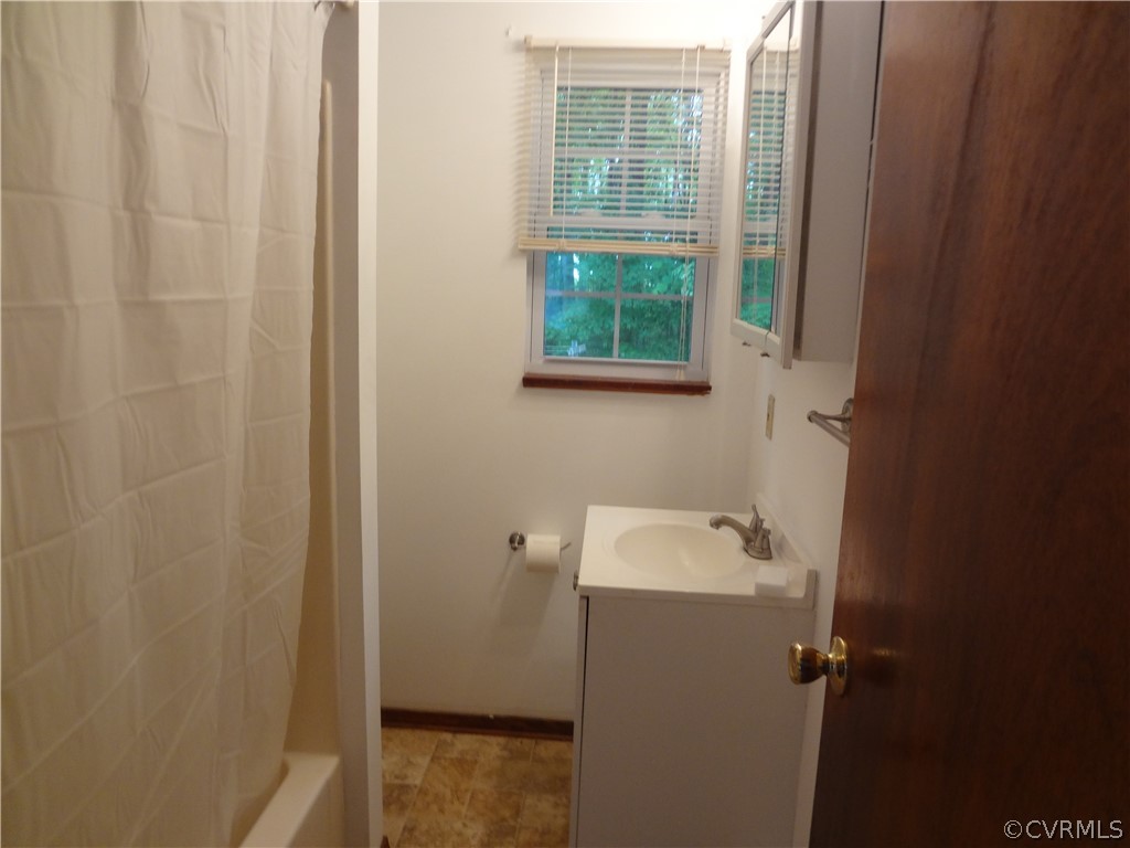 3198 Lowry Road Columbia, VA 23038 - Photo 2 of 19 a bathroom with a sink and a window