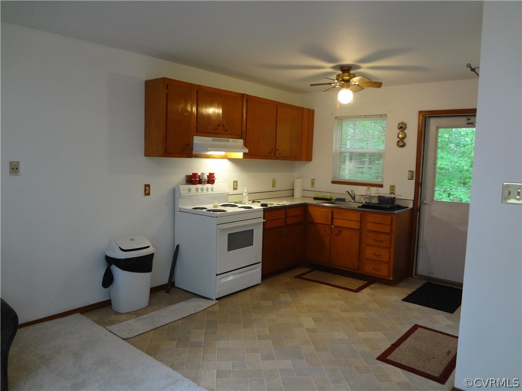 3198 Lowry Road Columbia, VA 23038 - Photo 4 of 19 a kitchen with a sink cabinets and window