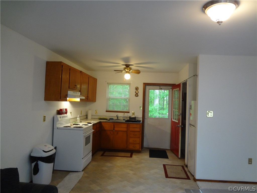 3198 Lowry Road Columbia, VA 23038 - Photo 5 of 19 a kitchen with a sink stainless steel appliances cabinets and a window