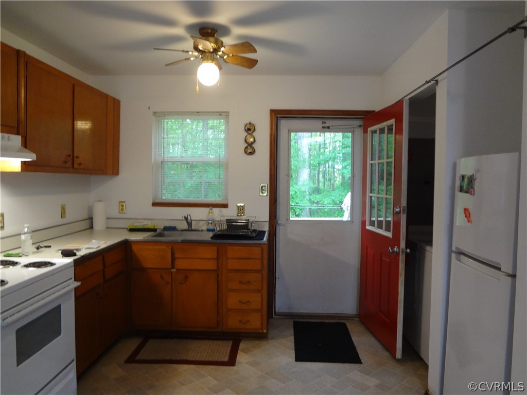 3198 Lowry Road Columbia, VA 23038 - Photo 6 of 19 a kitchen with a window a sink and a refrigerator