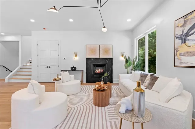 a large bathroom with a large mirror vanity and a shower