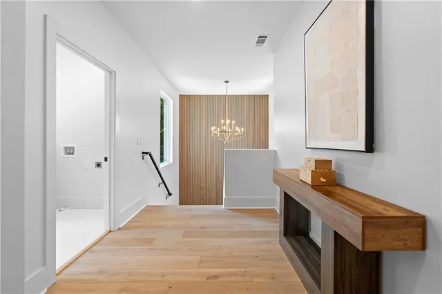 a bedroom with a large bed and a large window