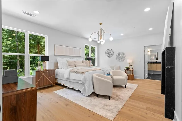 a bedroom with a bed and a painting