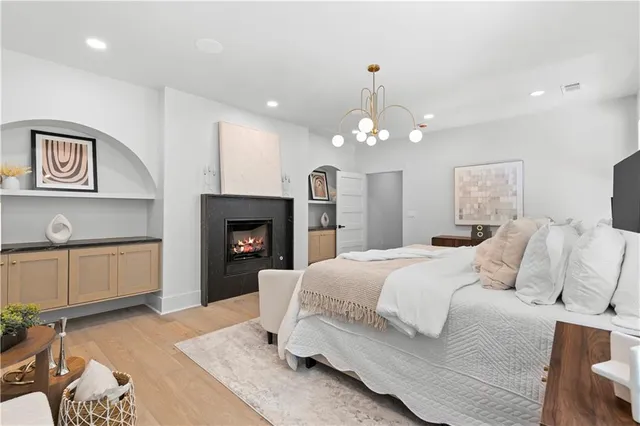 a bathroom with a granite countertop sink mirror and bathtub