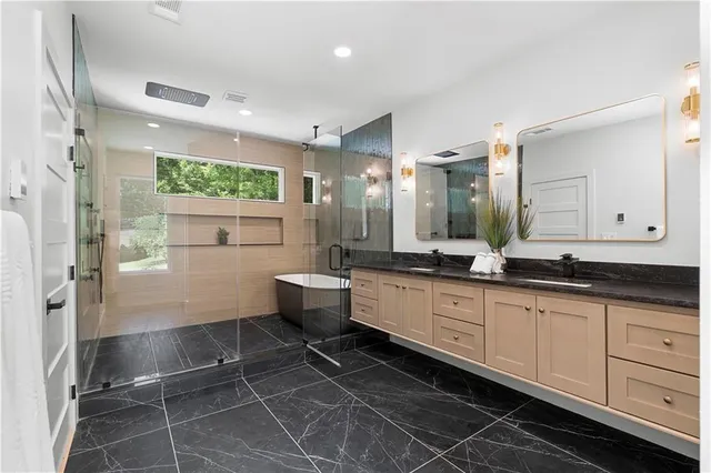 a view of a two chairs in the balcony