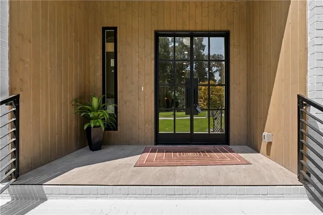 a living room with furniture fireplace and window