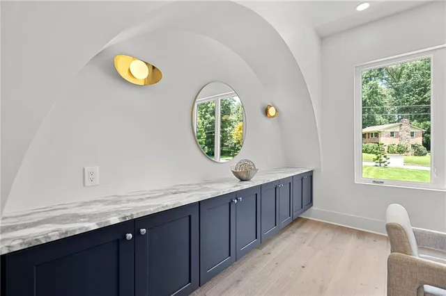 a living room with furniture fireplace and window
