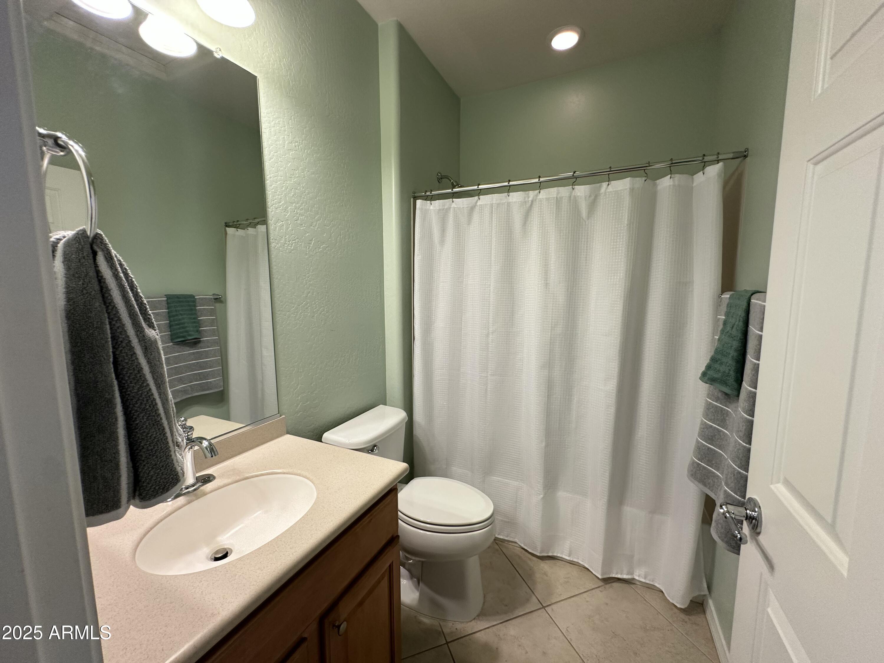 21280 North 262nd Drive Buckeye, AZ 85396 - Photo 28 of 51 a bathroom with a sink a toilet and shower