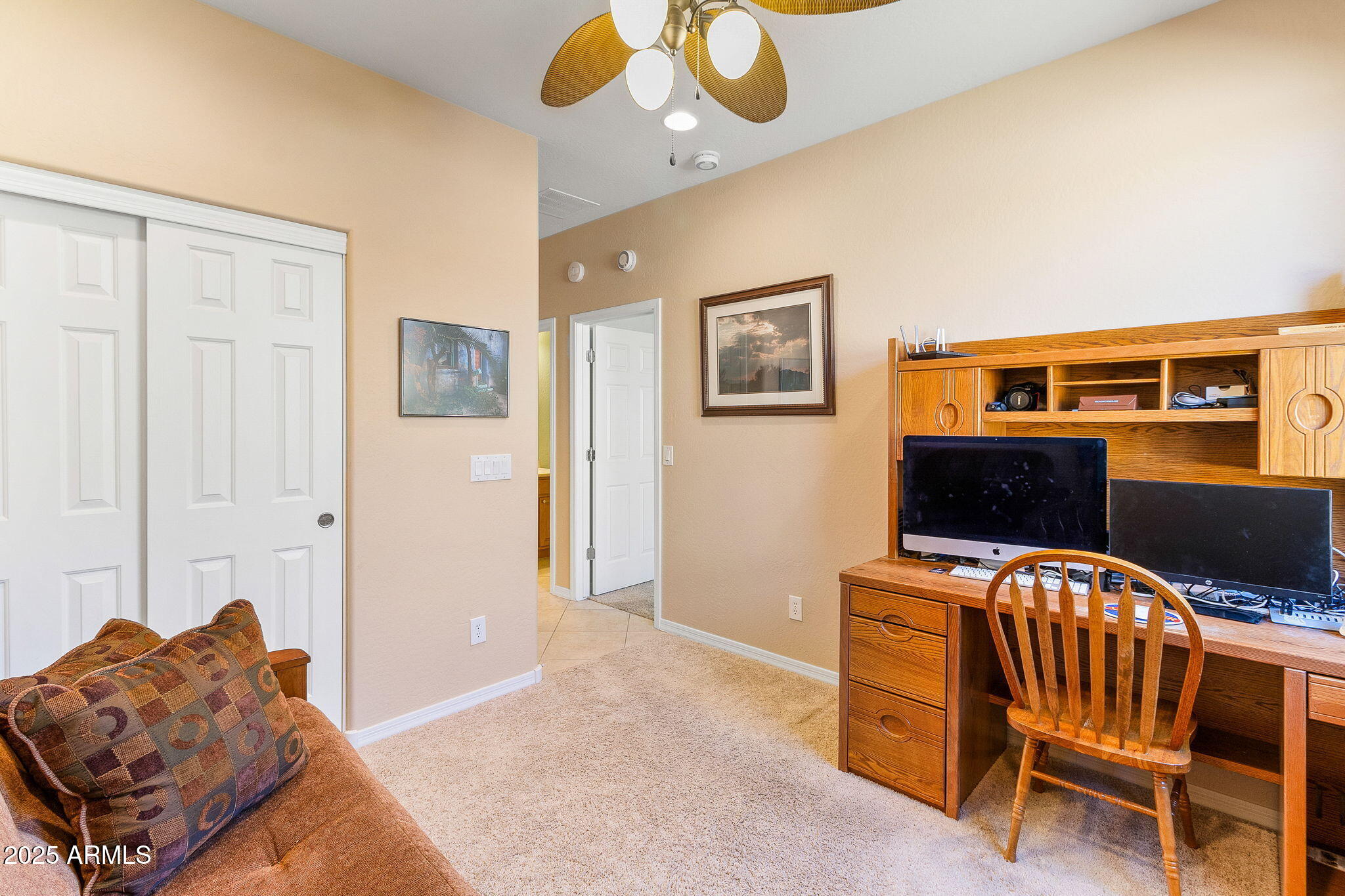 21280 North 262nd Drive Buckeye, AZ 85396 - Photo 30 of 51 a bedroom with a bed and wooden floor