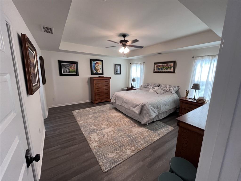 245 S Ridge Senoia, GA 30276 - Photo 15 of 25 a bedroom with a bed and a chandelier