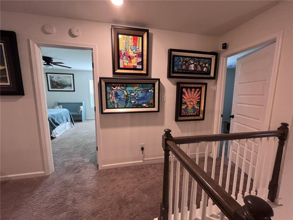 245 S Ridge Senoia, GA 30276 - Photo 20 of 25 a view of a hallway with wooden floor and windows