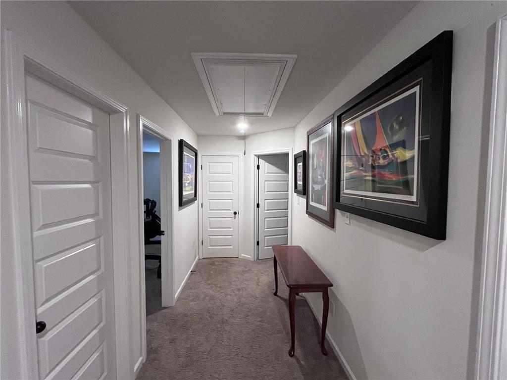 245 S Ridge Senoia, GA 30276 - Photo 21 of 25 a view of a hallway with paintings on the wall