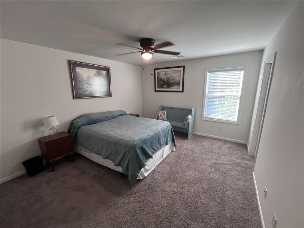 245 S Ridge Senoia, GA 30276 - Photo 22 of 25 a bedroom with a bed and a window