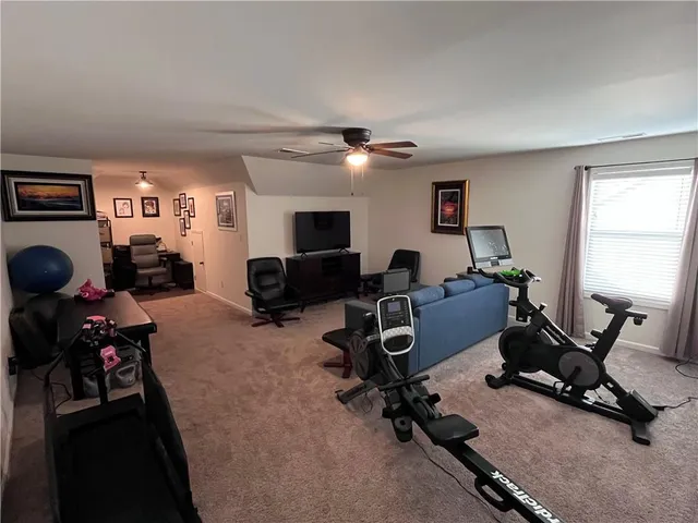 a spacious bathroom with a double vanity sink a mirror and a shower