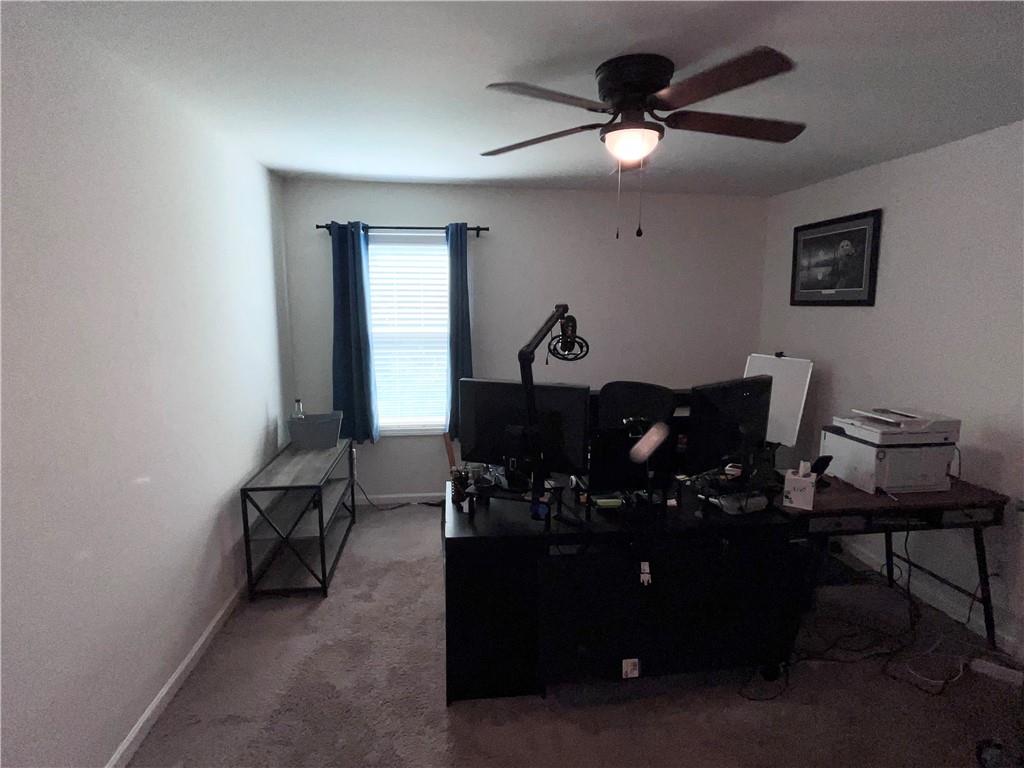 245 S Ridge Senoia, GA 30276 - Photo 25 of 25 a living room with furniture and a potted plant