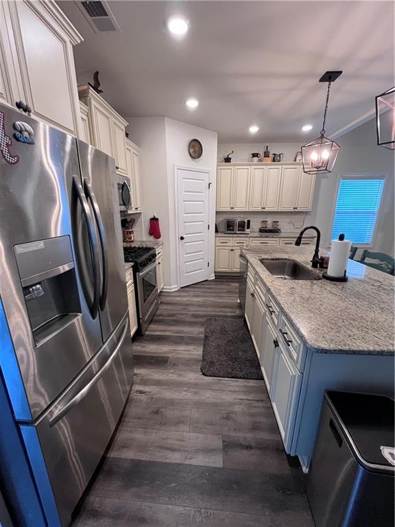 245 S Ridge Senoia, GA 30276 - Photo 7 of 25 a kitchen with stainless steel appliances granite countertop a sink and a refrigerator