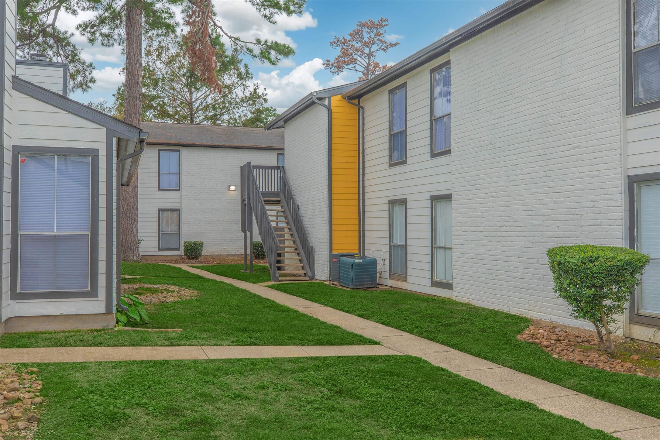 21717 Inverness Forest Boulevard, Unit 1112 Houston, TX 77073 - Photo 22 of 33 a front view of a house with garden