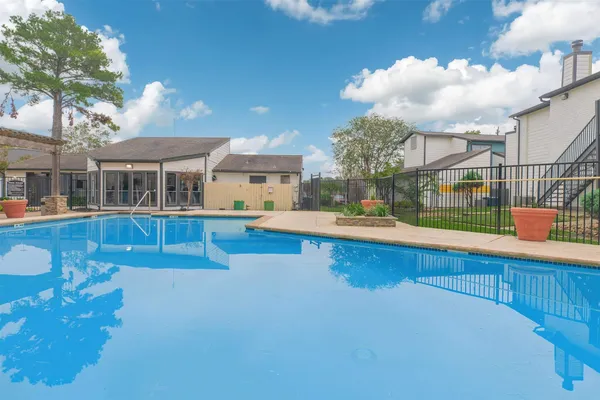 a view of swimming pool with outdoor seating and city view
