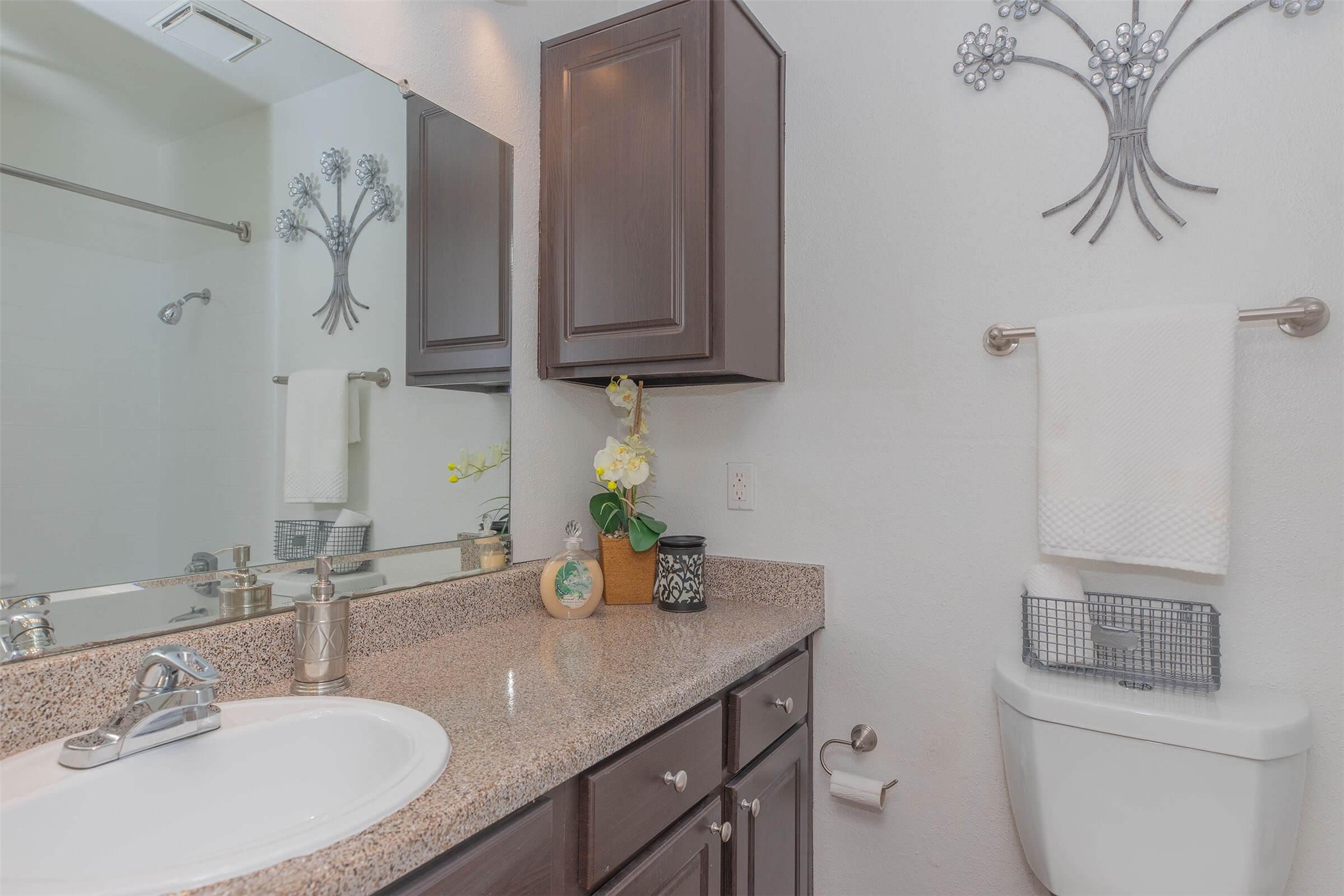 21717 Inverness Forest Boulevard, Unit 1112 Houston, TX 77073 - Photo 9 of 33 a bathroom with a sink and a mirror