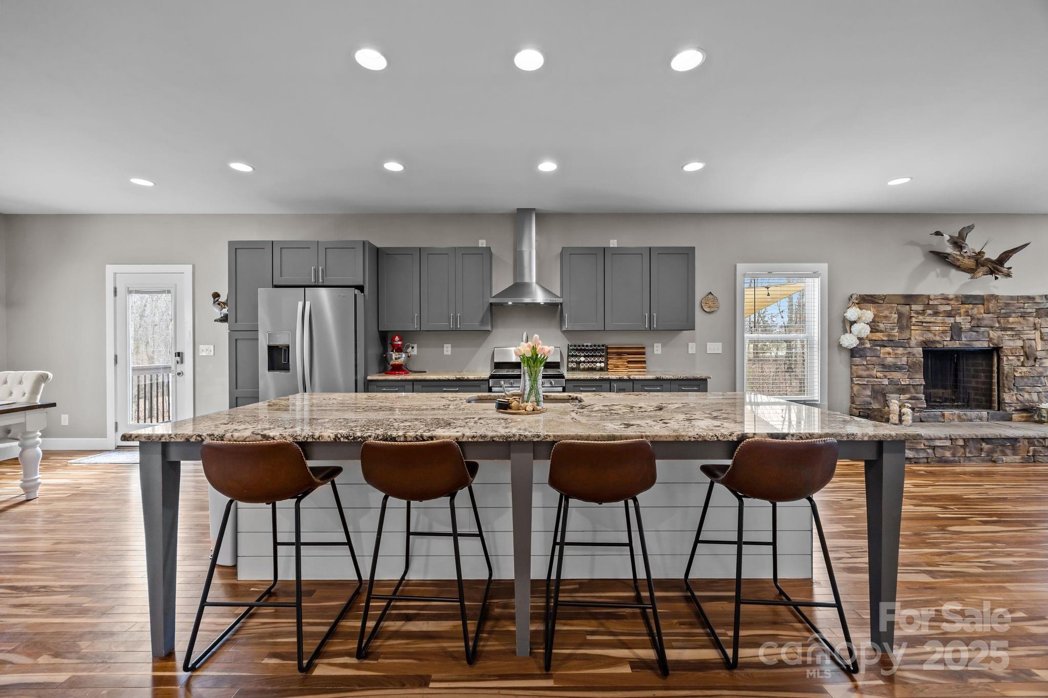 5321 Vesuvius Furnace Road Iron Station, NC 28080 - Photo 14 of 48 a kitchen with granite countertop a counter top space appliances and cabinets