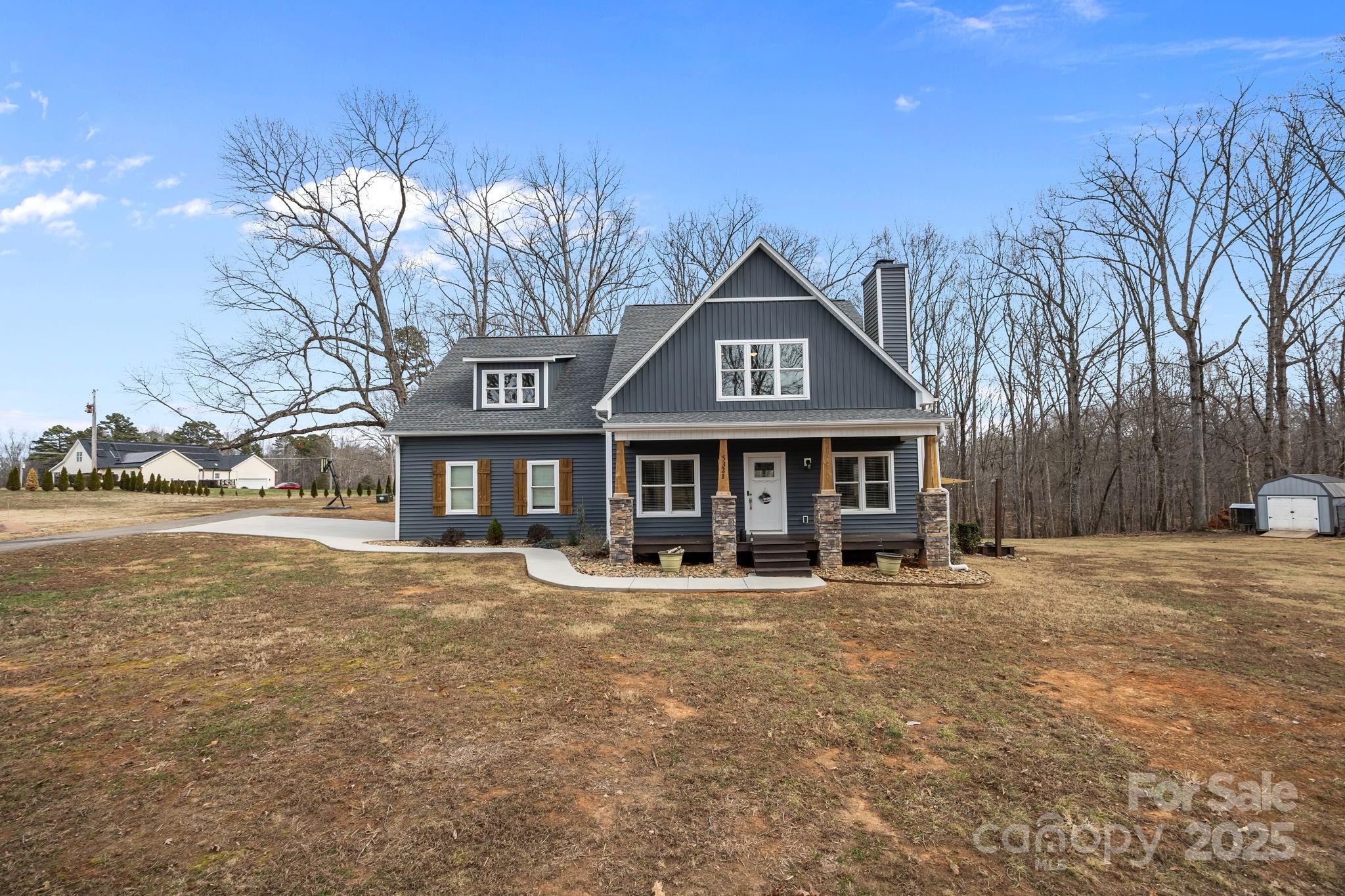 5321 Vesuvius Furnace Road Iron Station, NC 28080 - Photo 2 of 48 a front view of a house with a yard