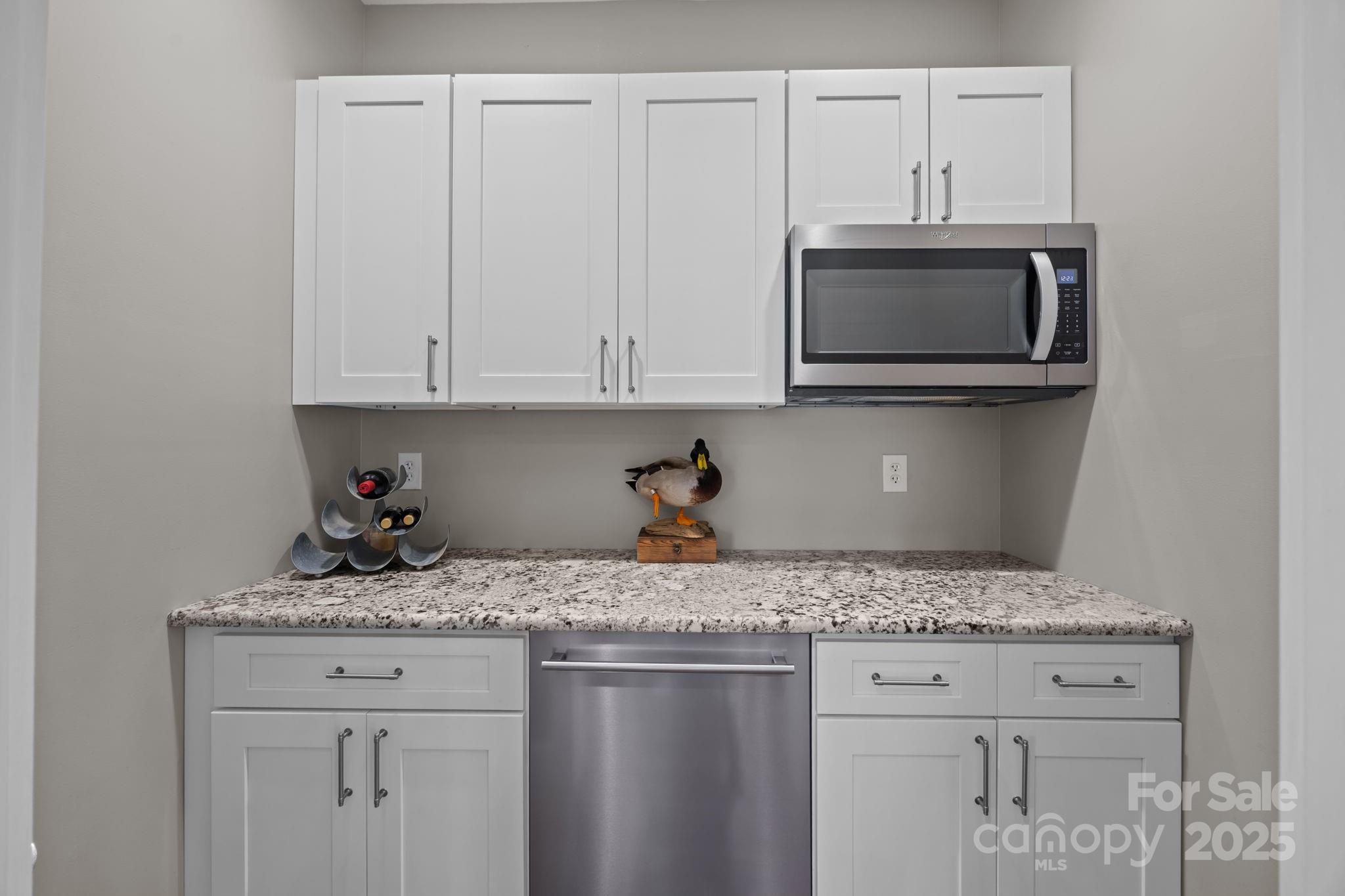 5321 Vesuvius Furnace Road Iron Station, NC 28080 - Photo 21 of 48 a kitchen with granite countertop white cabinets and a sink