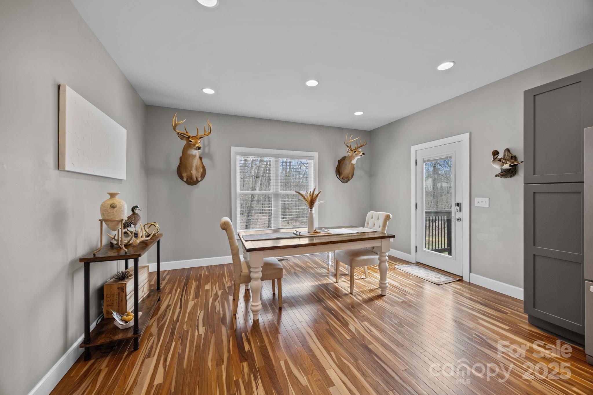 5321 Vesuvius Furnace Road Iron Station, NC 28080 - Photo 26 of 48 a view of a dining room with furniture and wooden floor