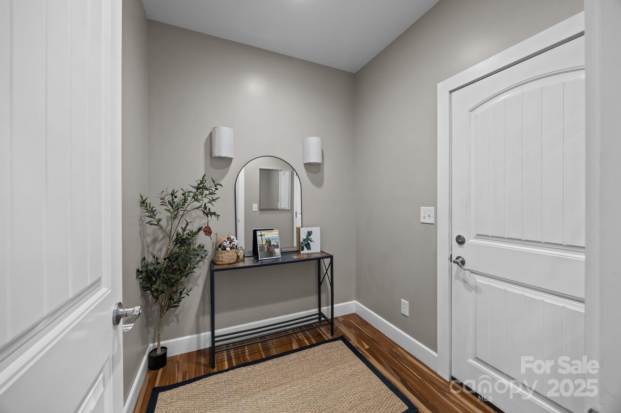 5321 Vesuvius Furnace Road Iron Station, NC 28080 - Photo 27 of 48 a view of a bedroom with a bench and hallway