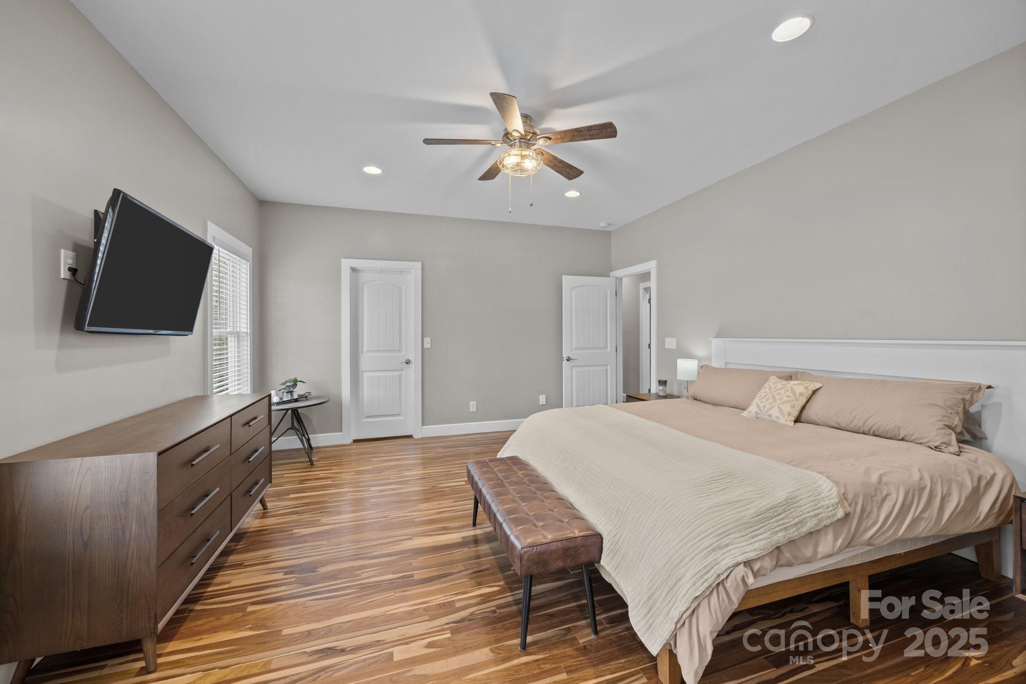 5321 Vesuvius Furnace Road Iron Station, NC 28080 - Photo 28 of 48 a bedroom with a bed and a flat screen tv
