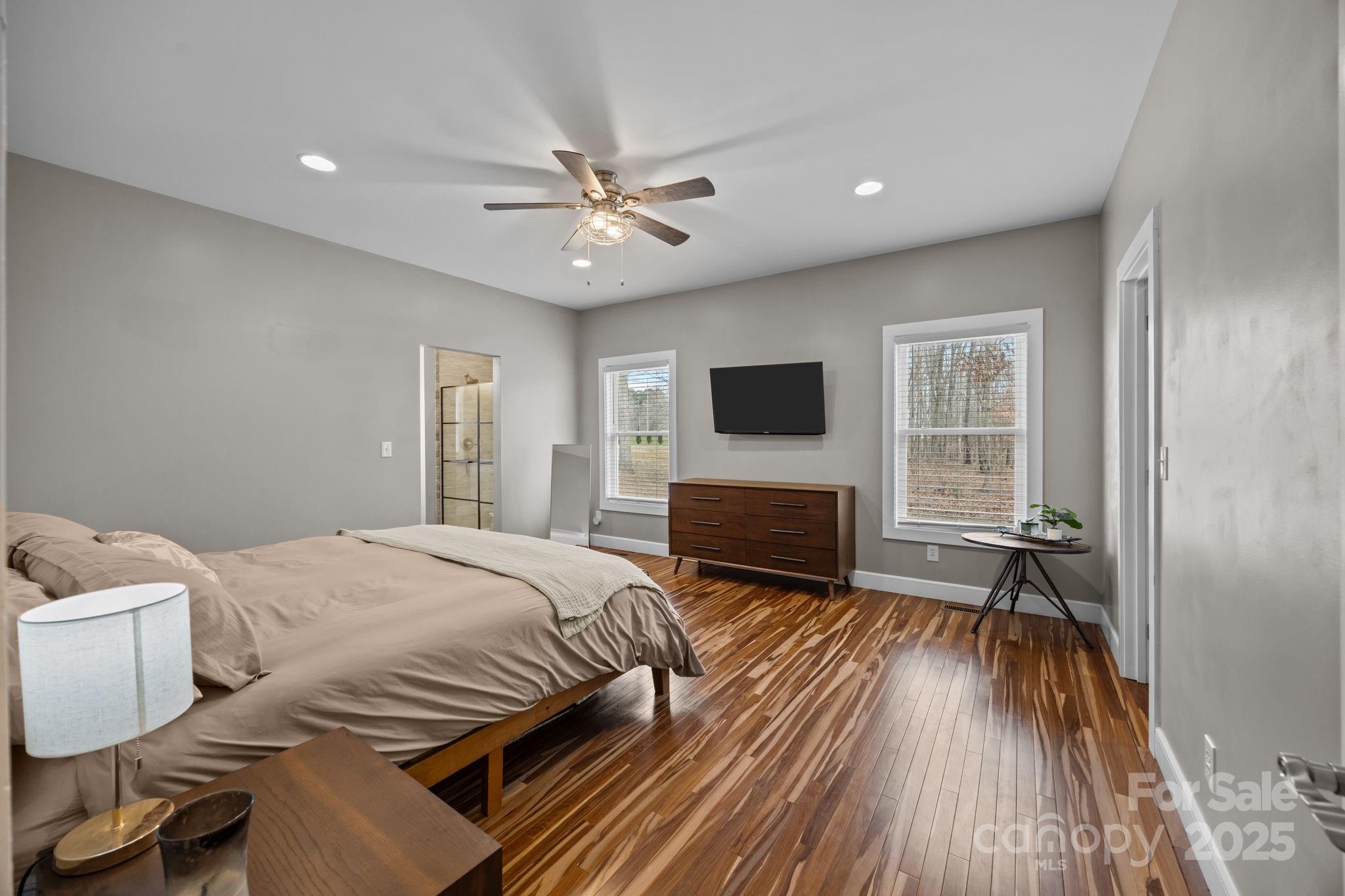 5321 Vesuvius Furnace Road Iron Station, NC 28080 - Photo 29 of 48 a bedroom with a bed and a flat screen tv