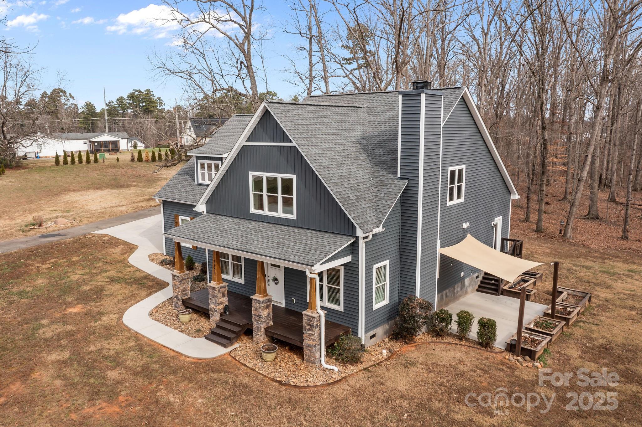 5321 Vesuvius Furnace Road Iron Station, NC 28080 - Photo 3 of 48 a view of a house with backyard