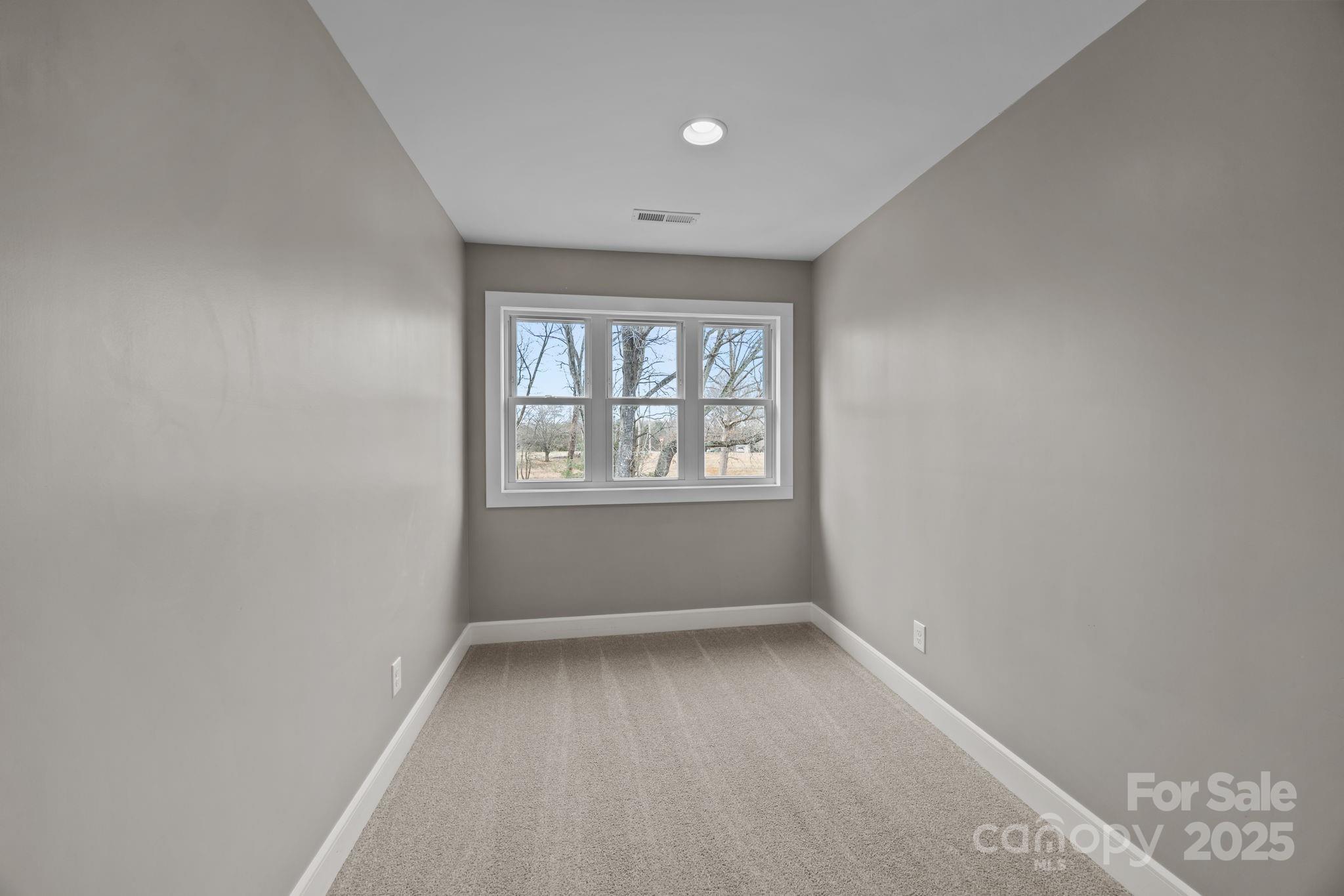 5321 Vesuvius Furnace Road Iron Station, NC 28080 - Photo 34 of 48 an empty room with windows