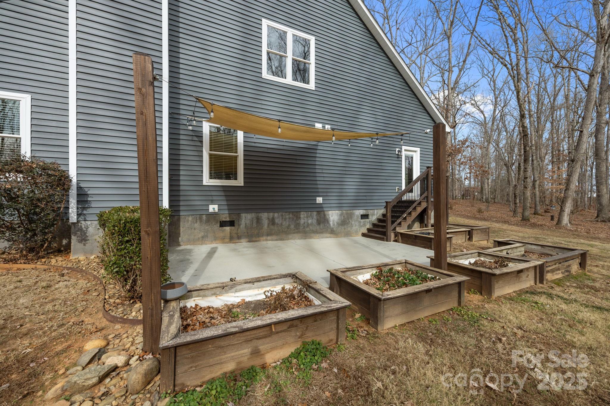 5321 Vesuvius Furnace Road Iron Station, NC 28080 - Photo 38 of 48 a view of a house with backyard and sitting area