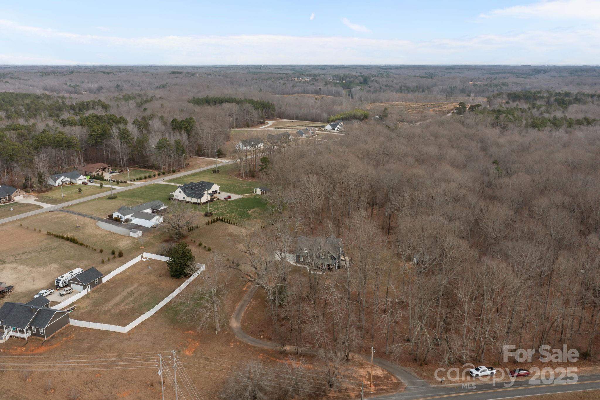 5321 Vesuvius Furnace Road Iron Station, NC 28080 - Photo 47 of 48 an aerial view of a house with a yard