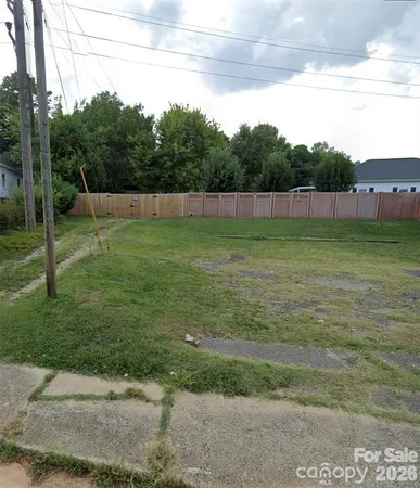 a view of a field with a big yard