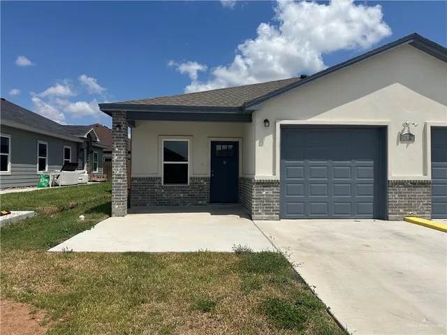 a view of house with yard