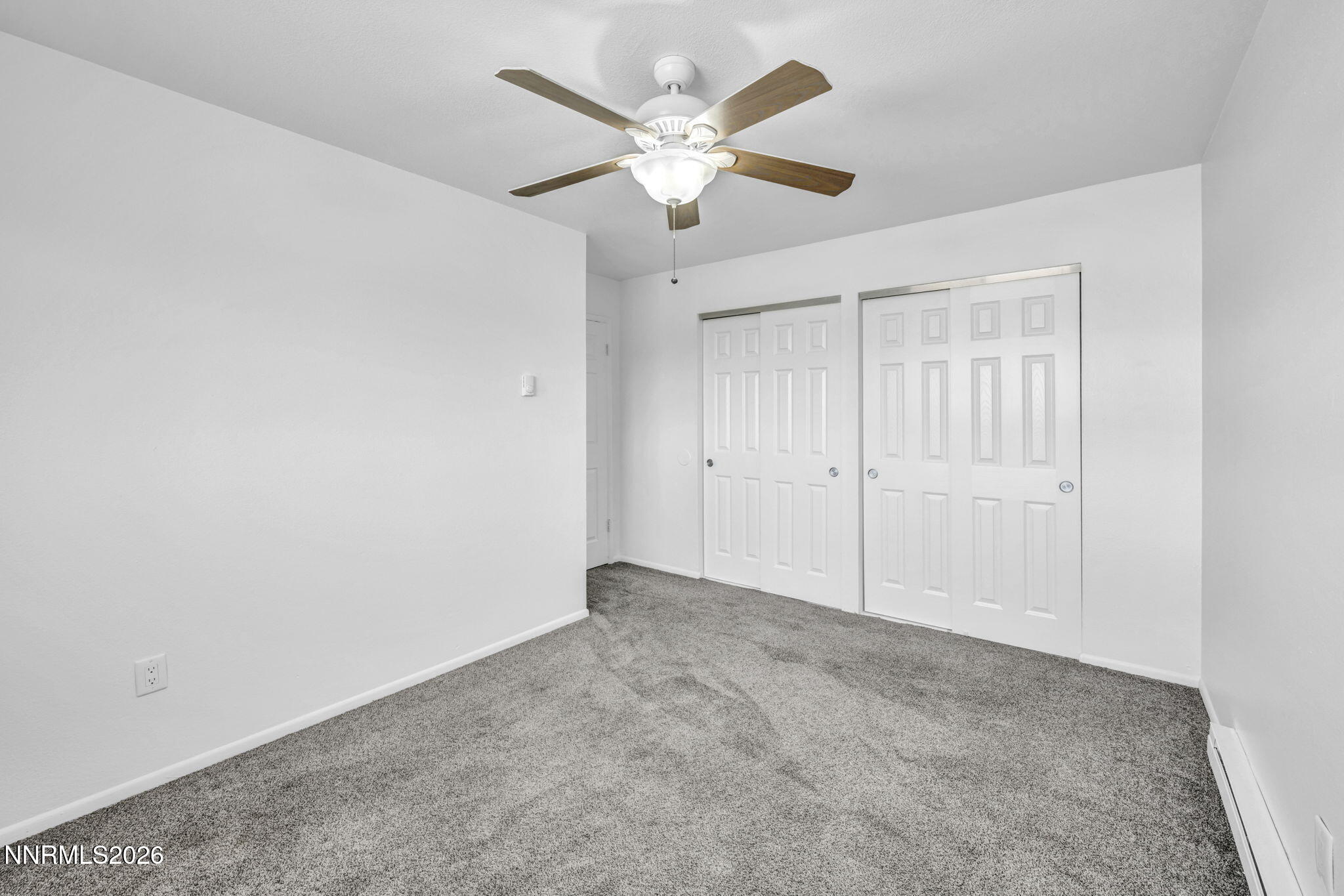 312 Smithridge Park Reno, NV 89502 - Photo 13 of 21 an empty room with fan and windows