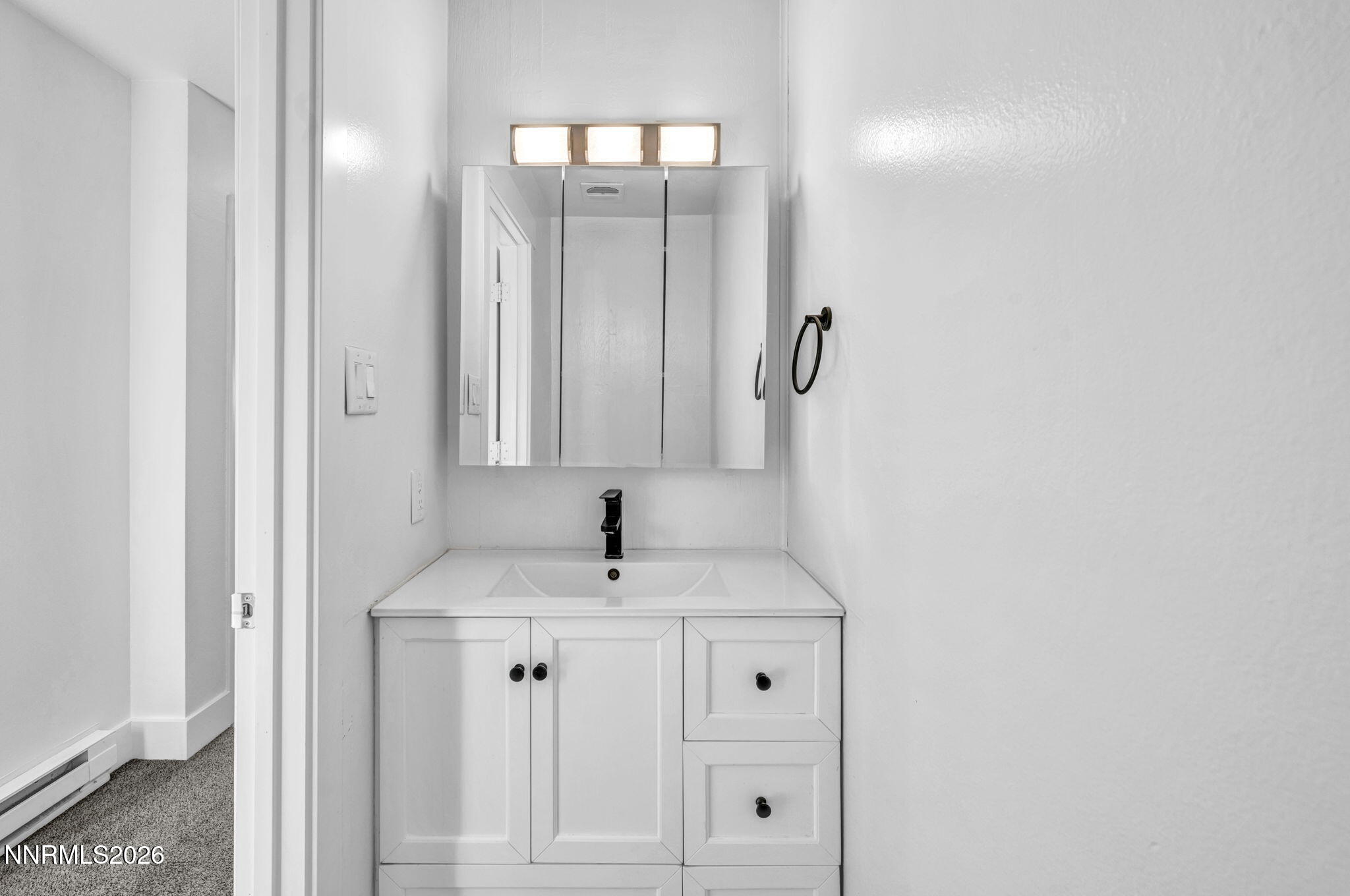312 Smithridge Park Reno, NV 89502 - Photo 9 of 21 a bathroom with a sink and a mirror
